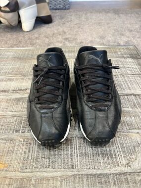 Puma Black Leather Low-Top Sneakers with White Sole Accent